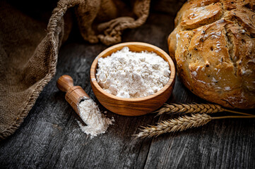 Wheat flour on an old wooden table