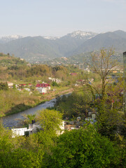 View from a height of the city and mountains. Suburb of a southern city and mountains