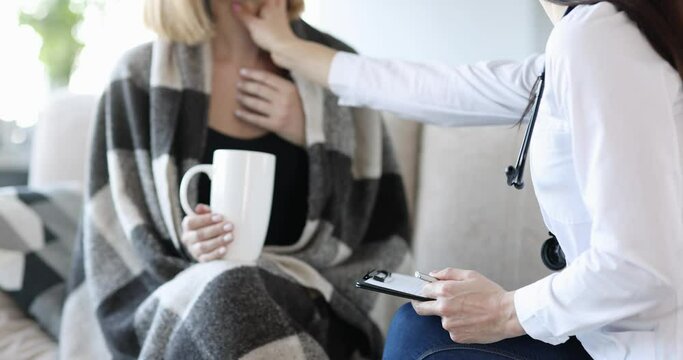 Doctor medical examination of throat of patient with cold at home