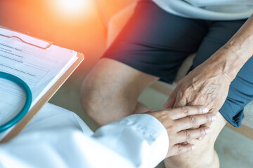 Geriatric doctor or geriatrician concept. Doctor physician hand on happy elderly senior patient to...