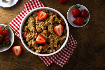 Homemade rhubarb crumble with strawberry