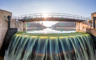 Long time exposure of the river Aare at the hydroelectric power plant Hagneck at the lake Biel in Switzerland - obrazy, fototapety, plakaty