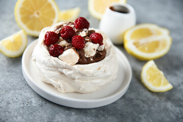 Homemade Pavlova dessert with raspberry and chocolate
