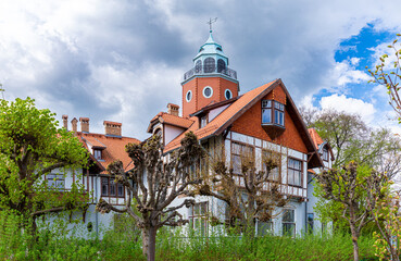 Old mansion in the garden in spring