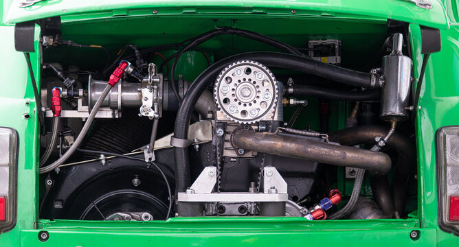 Engine detail of Fiat 500 race minicar standing in circuit paddock no people