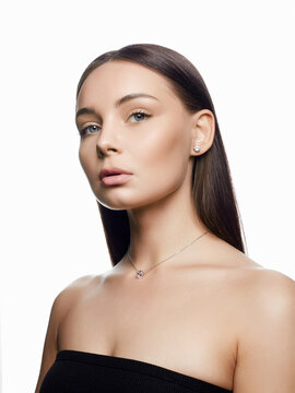 woman with elegant necklace and earrings. pretty girl in jewelry