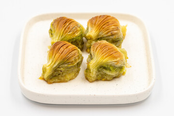 Mussel baklava. Pistachio baklava isolated on a white background. Mediterranean cuisine delicacies. Close-up. local name midye baklava
