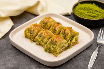 Pistachio baklava. Baklava with pistachio on a dark background. Mediterranean cuisine delicacies. Close-up. local name cimcik baklava