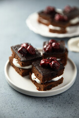 Chocolate cake with cherries and cream