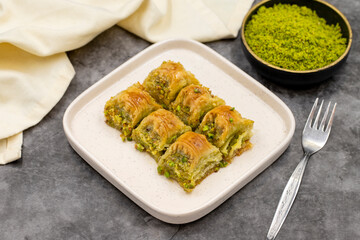Pistachio baklava. Baklava with pistachio on a dark background. Mediterranean cuisine delicacies. Close-up. local name cimcik baklava