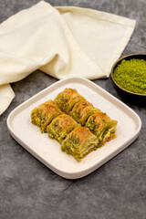 Pistachio baklava. Baklava with pistachio on a dark background. Mediterranean cuisine delicacies. Close-up. local name cimcik baklava