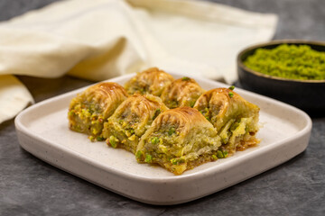 Pistachio baklava. Baklava with pistachio on a dark background. Mediterranean cuisine delicacies. Close-up. local name cimcik baklava