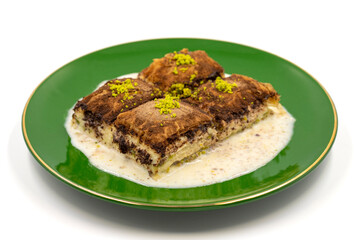 Dark chocolate baklava. Baklava with milk isolated on a white background. Mediterranean cuisine delicacies. Close-up. Local name bitter soguk baklava
