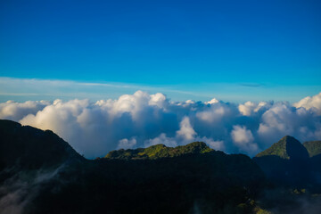 foggy with cloud on top of mountain morning sunset light