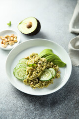 Couscous with pesto, cucumber and avocado
