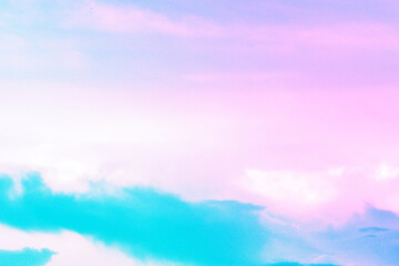 Obraz na płótnie Canvas A pastel colored sky and cloud background.