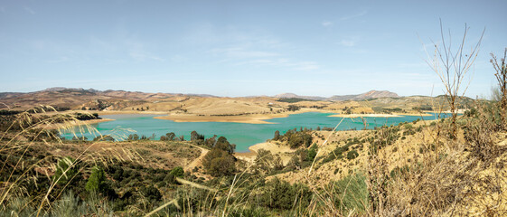 Scenic view of  Conde de Guadalhorce Reservoir and its turquoise water in Malaga, Andalusia, Spain