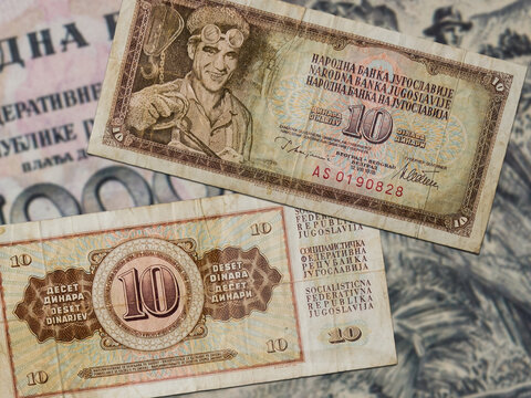 Top view of yellow old damaged weathered Yugoslavian 10 dinars banknotes