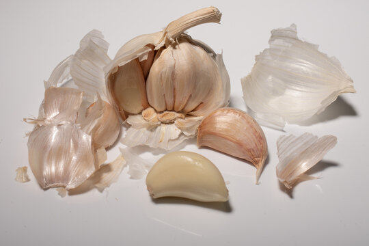 Closeup shot of an open garlic on a white background