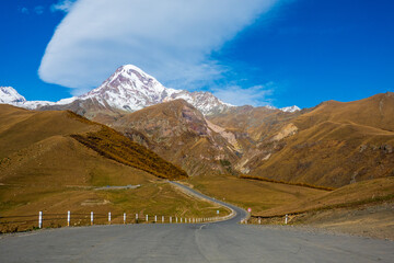 Road through mountains in autumn