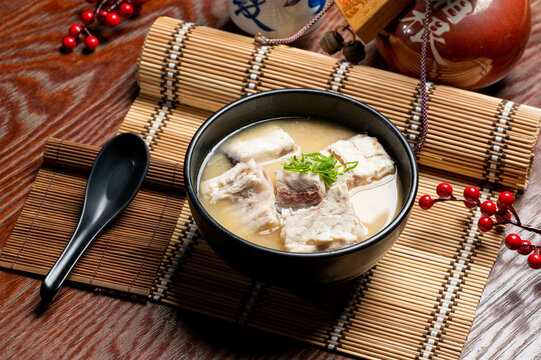 Fish Bone Miso Soup in a bowl with chopsticks isolated on mat side view of taiwan food