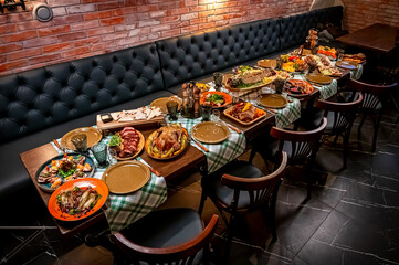 Restaurant table, many different dishes.