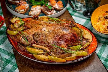 Baked duck with apples on the festive table