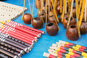 KOLKATA, WEST BENGAL , INDIA - NOVEMBER 23RD 2014 : Flutes and monochords, artworks of handicraft,...