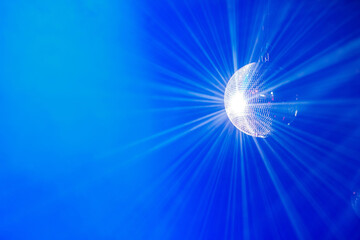 Illustration design of The rays of a mirror disco ball on a blue background