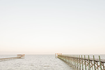 Scenic view of wooden piers on the seascape on a sunny day in Fairhope, Alabama