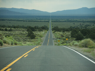 Closeup of an empty highway in the middle of farm field in California