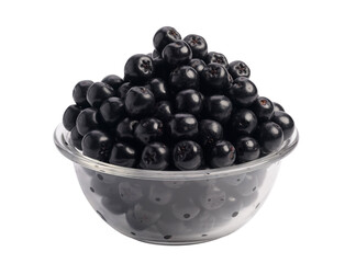 Сhokeberry berries in a plate, isolated on a white background