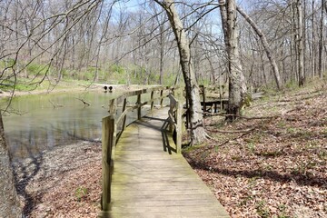 The empty wood boardwalk bridge on the trail.