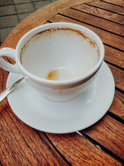 empty cup of coffee on a wooden table 