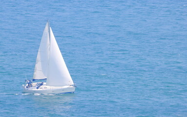 Beautiful sailing yacht on blue ocean  