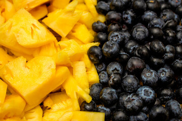 Fresh fruits background, Tropical fruit and berries are consisted of slice pineapple and blueberry