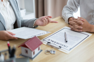 Insurance concept the broker explaining the agreement of the contract to his customer