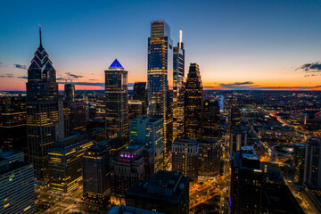 Aerial Drone View of Philadelphia Skyline at Sunset with Glowing City Lights