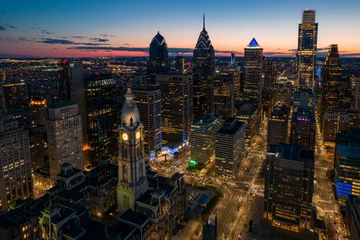 Muurstickers Aerial Drone View of Philadelphia Skyline at Sunset with Glowing City Lights with Town Hall in Foreground  © suraju