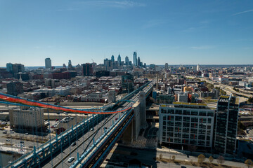 Fototapeta premium Aerial Drone View of Philadelphia on a Clear Sunny Day with Bridge Over a River in Foreground