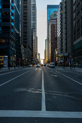 Cars Driving at Sunset by Buildings in Philadelphia