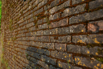 Old brick wall in vintage rusty grungy style for backgrounds and wallpapers