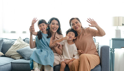 Asian family happy taking photo together in the living room.