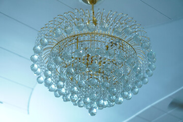 Closeup shot of the details of a chandelier on a cieling