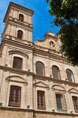 Back facade of the Church of Santo Domingo in Murcia made of brick, with towers and arches