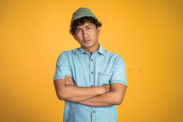 portrait of unsure asian young man thinking on isolated background