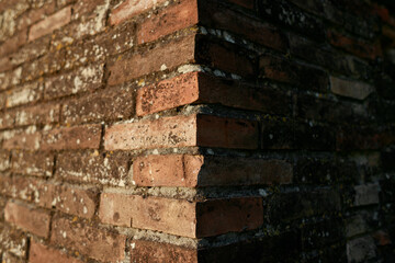 Old brick wall in vintage rusty-rough style for backgrounds and wallpapers. Italian fortress.