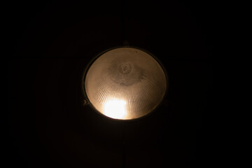 Plastic dome covering lamp.
