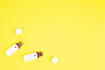 USB flash drive on a yellow background