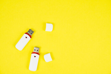 USB flash drive on a yellow background